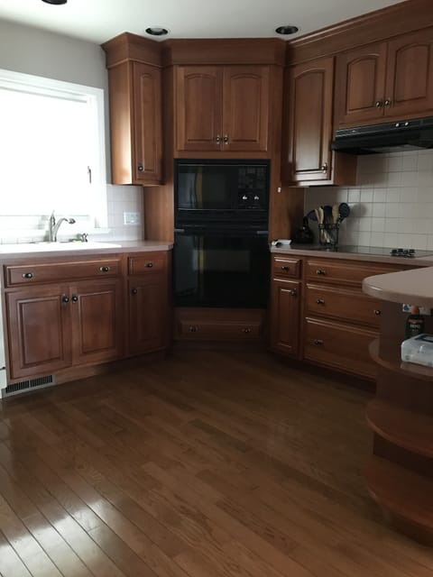 Kitchen with oven, microwave, stovetop, toaster, coffee maker, carafe, blender