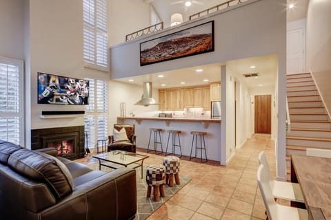 Great Room with fireplace, HDTV, tons of light - looks out to golf course. A great place to unwind with friends/family after an active day!