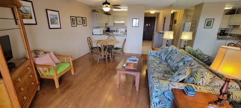 Living area with sofa sleeper, dining, kitchen, entry hall