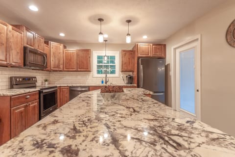 7 foot island with new cabinets, countertops and appliances