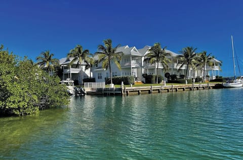 Waterfront paradise in Marathon with protected dockage and tropical views. 