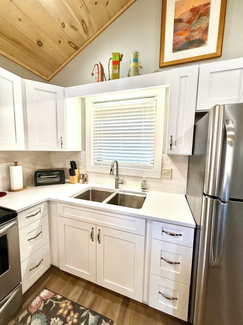 Brand new soft close solid oak kitchen cabinets and white quartz counters