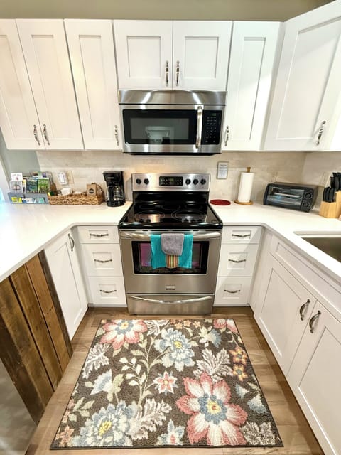 Brand new soft close solid oak kitchen cabinets and white quartz counters