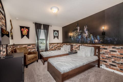 - Experience the magic of our themed room, complete with two cozy single beds. - Stunning wardrobe with sufficient space - Enjoy the Availability of Smart Tv and Netflix - Indulge in mesmerizing views from the windows of the room