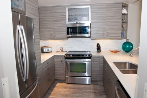 Bright, open gourmet kitchen with stainless steel appliances