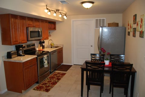 Second kitchen in basement with stainless steel appliances