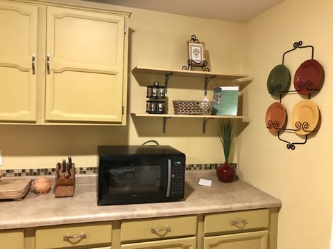 Microwave and open shelves for food storage