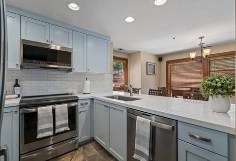 Kitchen: Sleek appliances and bright windows make this your culinary adventure hub!