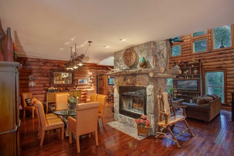 Stacked Stone Fireplace central to Great Room and Dining Room