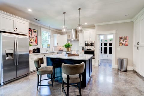6 barstools available to enjoy hanging in the kitchen.  Entry to large laundry.