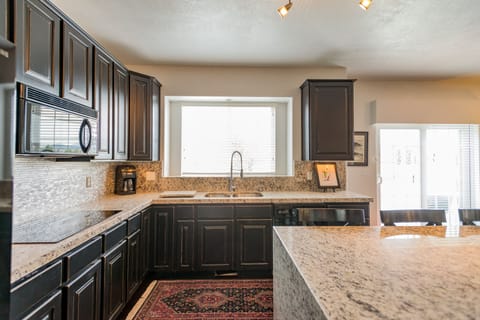 The kitchen has all the appliances required for meal preparation.