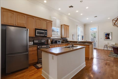 Chef's kitchen opens to spacious den.