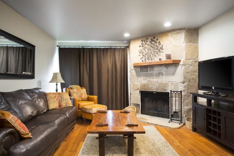Living room with wood-burning fireplace. Firewood is provided.