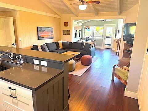 Living room with large comfy couch for watching television. 