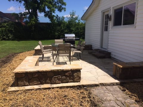 The new flagstone patio with stone sitting walls offers plenty of seating.