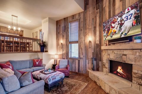 Living Room: Gather around the fireplace and enjoy game nights in this charming retreat!