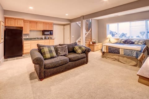 Bedroom 6 / Downstairs Suite - Queen with it's own couch, TV, kitchen area (including full size refrigerator, freezer, microwave, sink, and cabinets), walk-in closet, and bathroom with shower