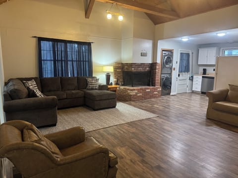 Open concept living room and kitchen. Wood burning fireplace. Washer/dryer