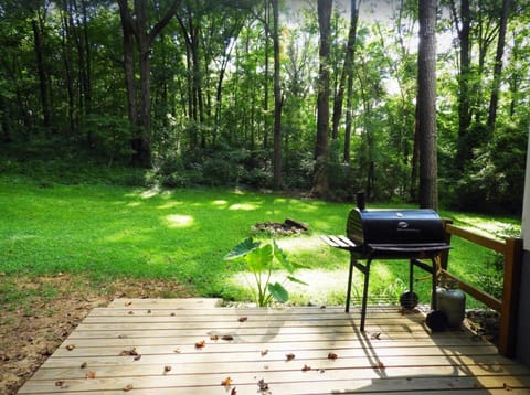 Deck with charcoal grill and large back yard