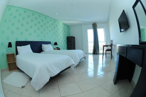 Standard Double or Twin Room | Minibar, desk, blackout drapes, iron/ironing board