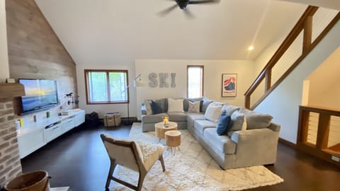 Stairs down to entry and 3 bedrooms & full bath. Upstairs loft w/ full size bed 