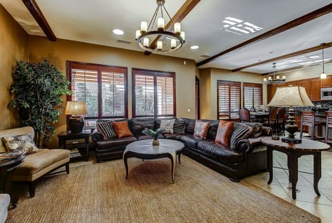 The living room is massive and open with a cabinet full of board games for the kids.