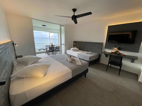 Deluxe Studio, Multiple Beds, Sea View, Oceanfront | Premium bedding, in-room safe, individually furnished, desk