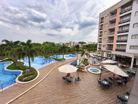 5 indoor pools, outdoor pool, open 7 AM to 11 PM, pool umbrellas