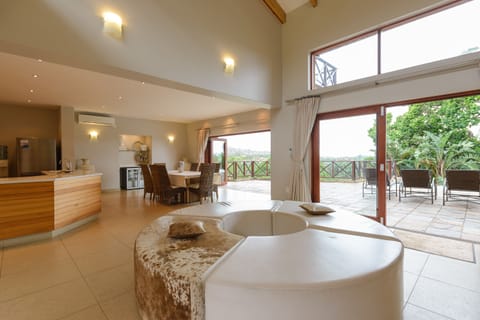 Deluxe Villa, 4 Bedrooms | Living room | Flat-screen TV