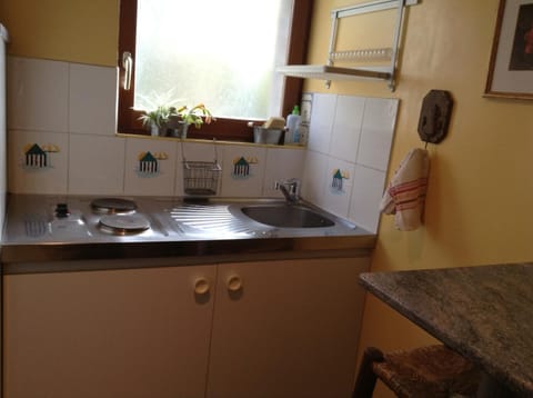 Shower, hair dryer, slippers, towels