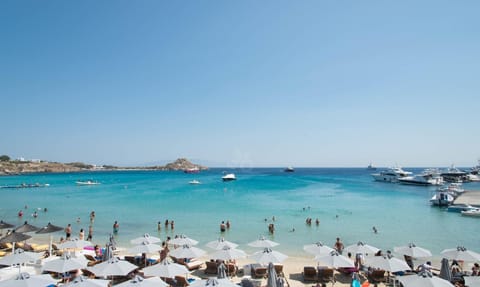 On the beach, sun loungers, beach umbrellas, beach towels