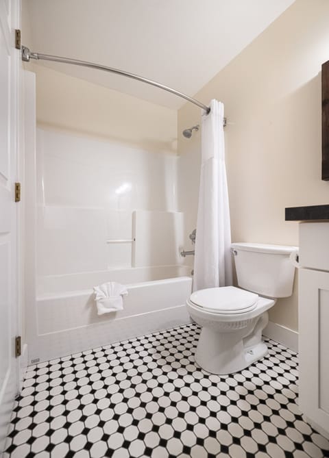 Superior Room, 1 King Bed, Refrigerator & Microwave | Bathroom | Combined shower/tub, hair dryer, towels, soap