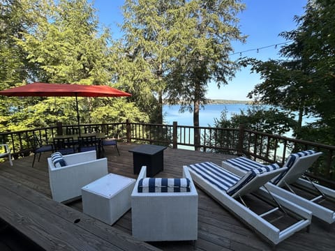 Amazing outdoor living space overlooking the gorgeous waters of Walloon Lake