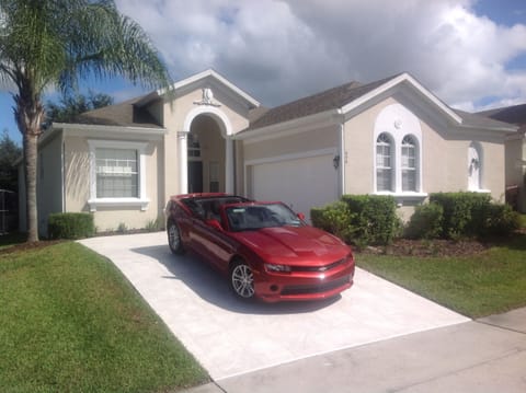 Front, tiled driveway for two vehicles, more spaces available on the street
