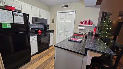 Small appliances inc. a waffle iron & instant pot are in the laundry closet