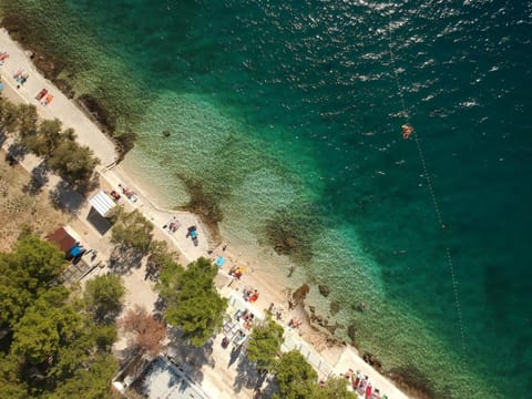 On the beach, sun loungers, beach umbrellas