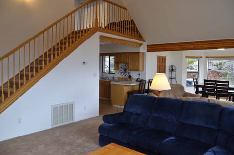 Views of the kitchen, dining and staircase from living room