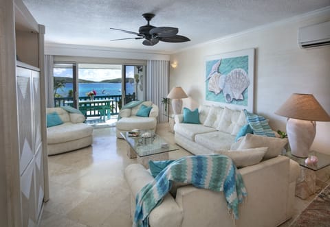 Living room area with walkout view of Little St. James and St. John. 