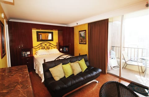 View into sleeping area with large his & her closets and balcony view