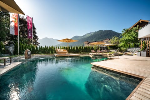 Indoor pool, seasonal outdoor pool, open 7 AM to 7 PM, pool umbrellas