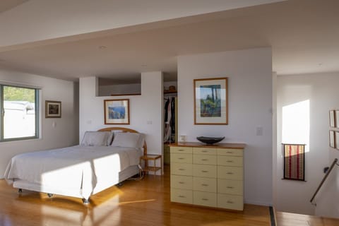Master bedroom with dressing room behind.