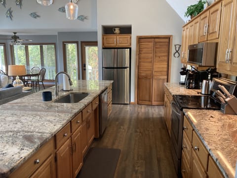 Spacious kitchen with 12’ granite island for family meals.