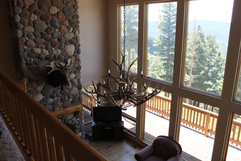 Upstairs looking down on living room.