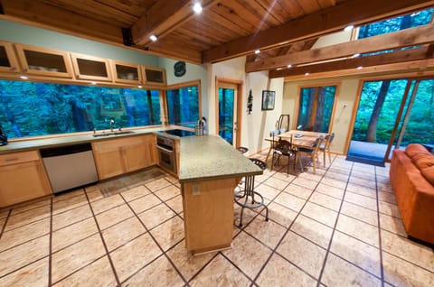 Recycled Glass Countertops, CustomOak Slab Table &10' WIndow Overlooking Creek