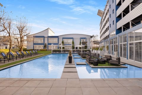 Outdoor pool, pool umbrellas, sun loungers