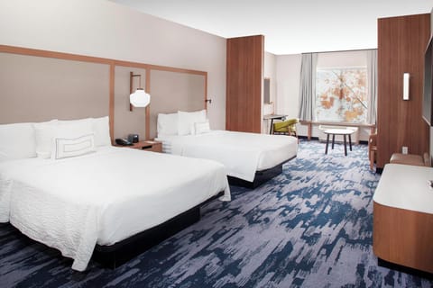 Desk, blackout drapes, iron/ironing board, free cribs/infant beds