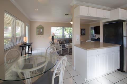 View from backdoor to open kitchen work counter & gathering  room