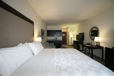 Desk, laptop workspace, blackout drapes, iron/ironing board