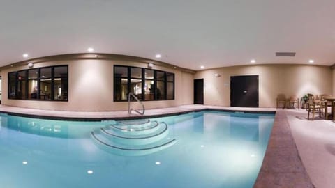 Indoor pool, open 7:00 AM to 11:00 PM, sun loungers