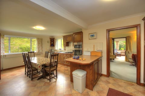 Kitchen diner which looks onto a hill field